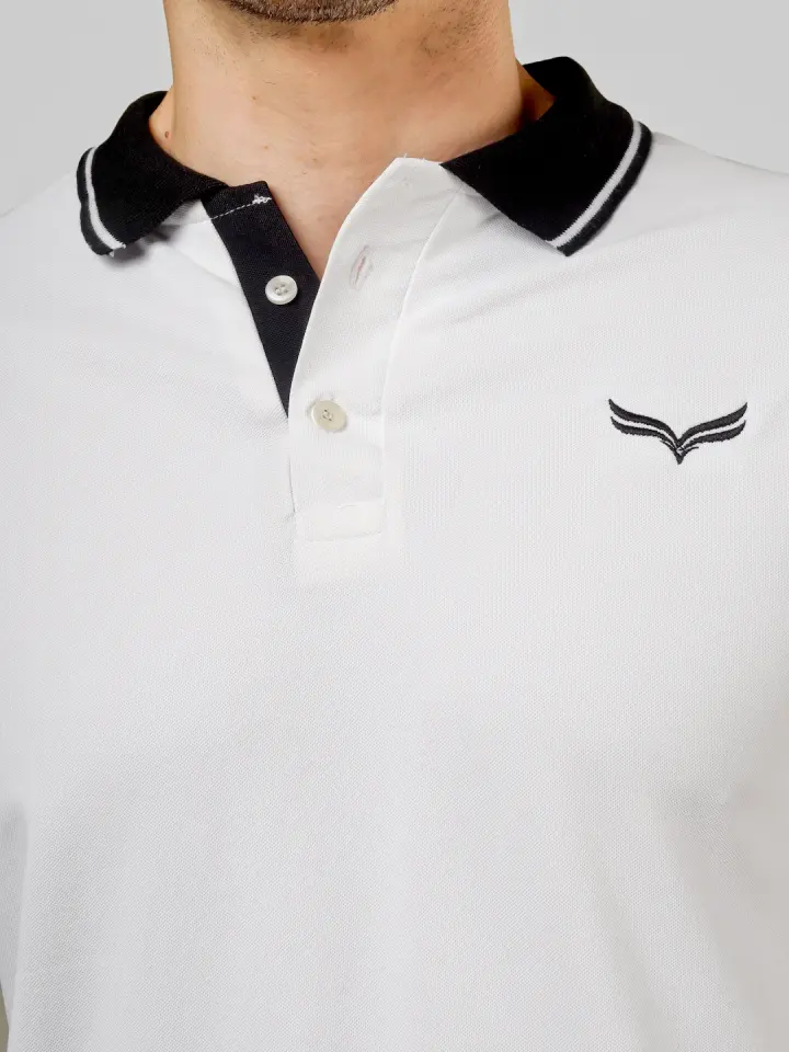 Embroidered logo on a BONND polo collar